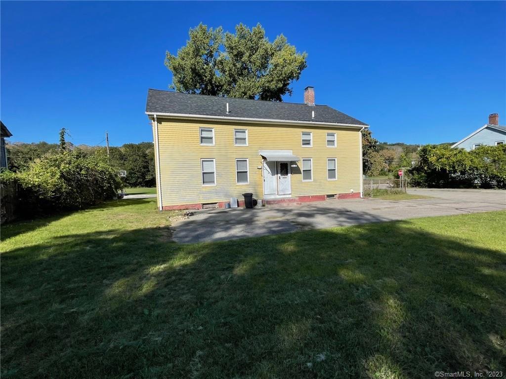 79 River Street, Unit 79 Sprague, CT 06330 - Photo 25 of 25 a view of a back yard of the house with green space