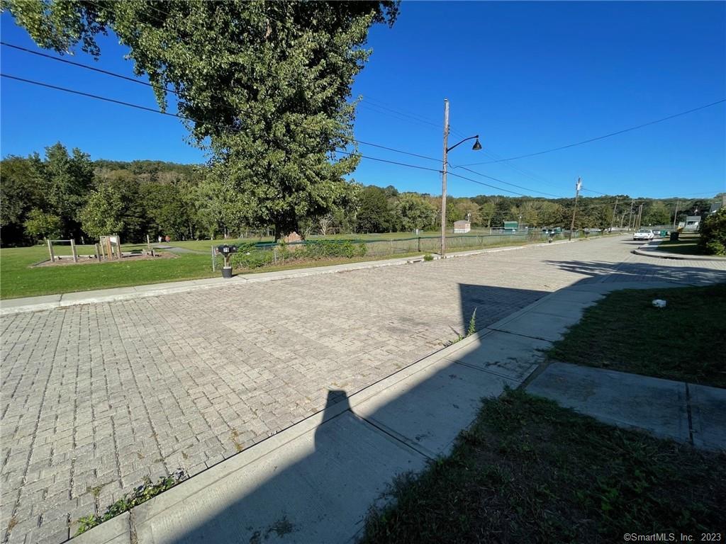 79 River Street, Unit 79 Sprague, CT 06330 - Photo 3 of 25 a view of a lake with a yard
