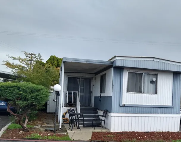 a front view of a house with stairs