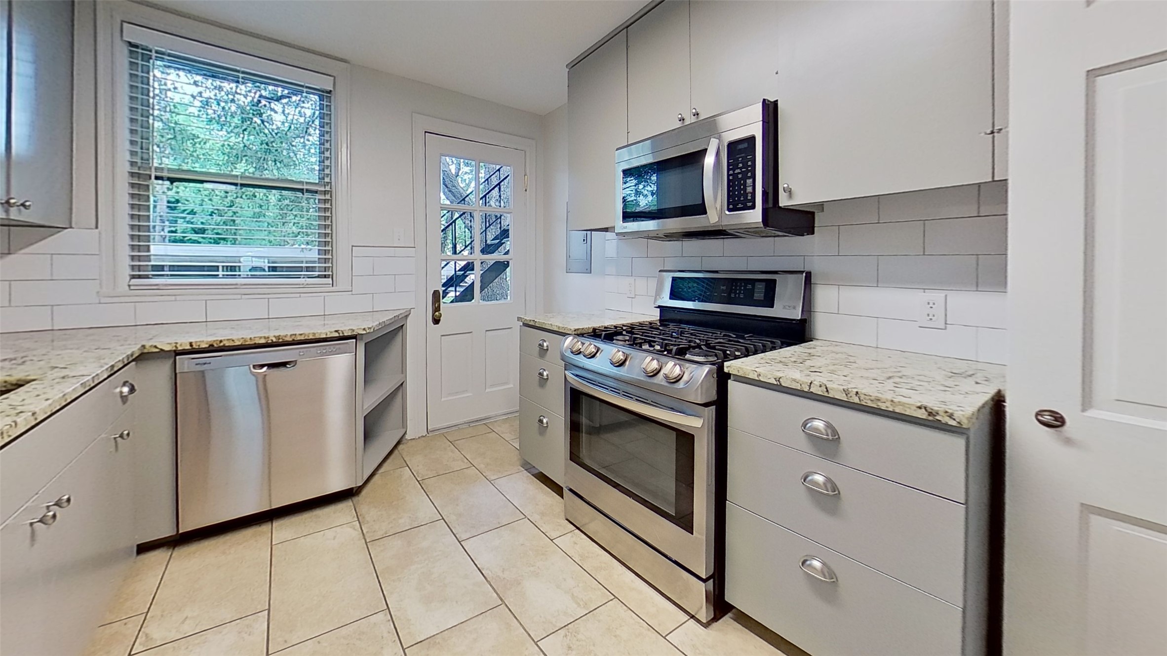 1703 Summit View Place, Unit A Austin, TX 78703 - Photo 6 of 13 Culinary creations come to life in this kitchen, featuring stainless appliances and granite countertops.