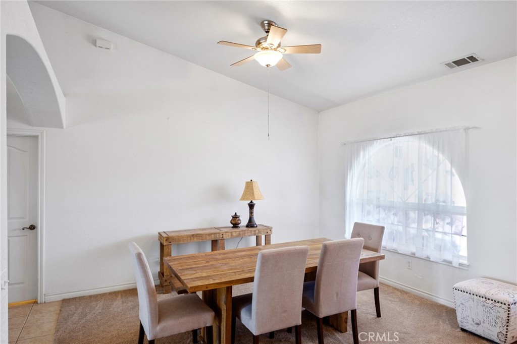 11025 El Esteban Road Phelan, CA 92371 - Photo 4 of 54 a view of a dining room with furniture window and outside view