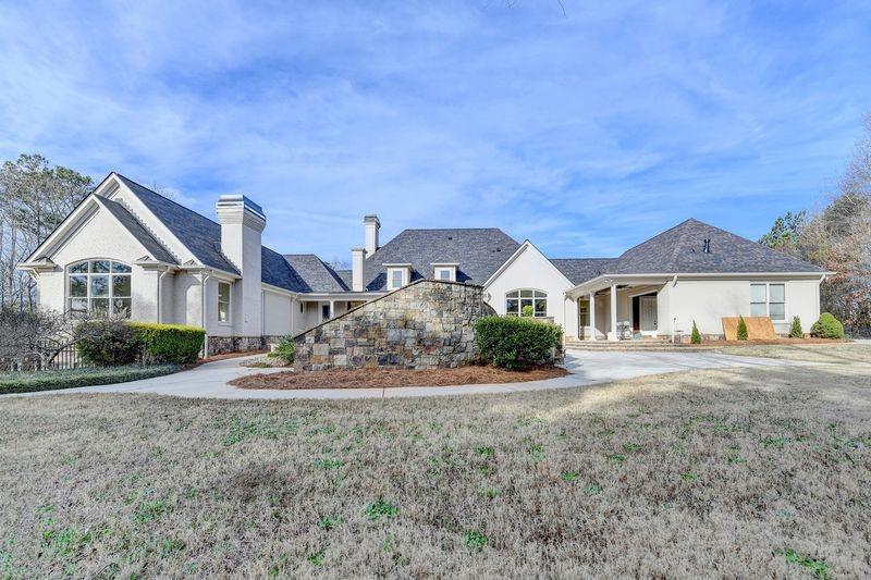 4045 Ridge Road Buford, GA 30519 - Photo 77 of 97 a front view of a house with a yard