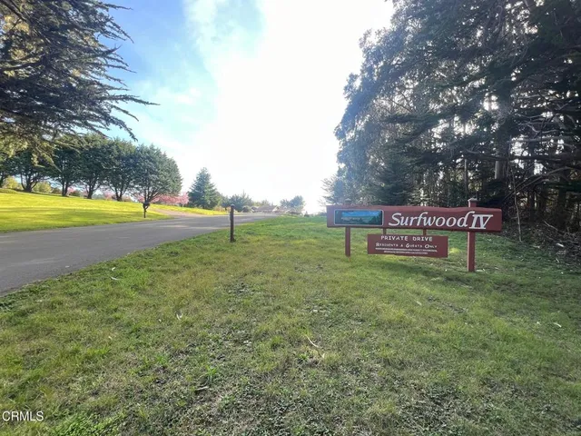 a view of a street with sign board