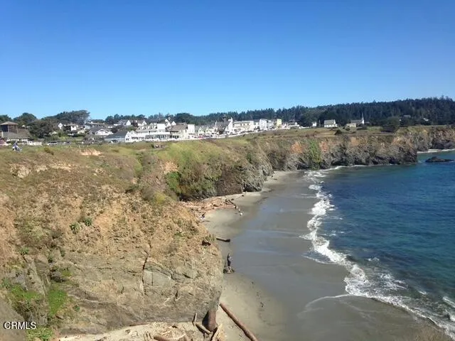 a view of a lake with beach