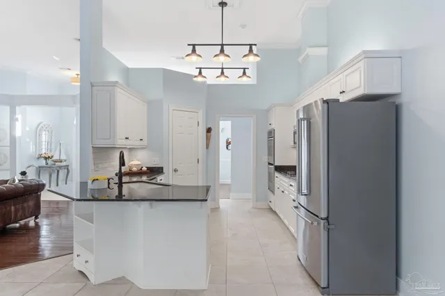 a view of a dining room with furniture wooden floor and chandelier