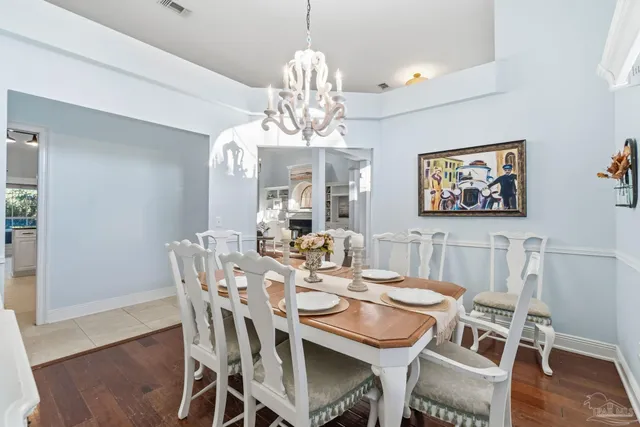 a spacious bathroom with a granite countertop sink a mirror and a shower