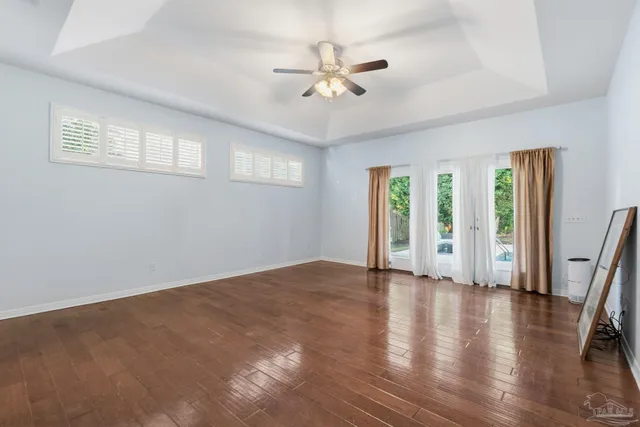 a bathroom with a shower a sink and a mirror