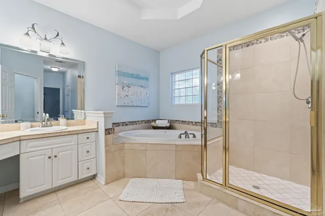 a bathroom with a toilet a sink and a mirror