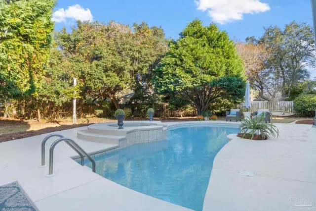 a living room with fireplace furniture and a wooden floor