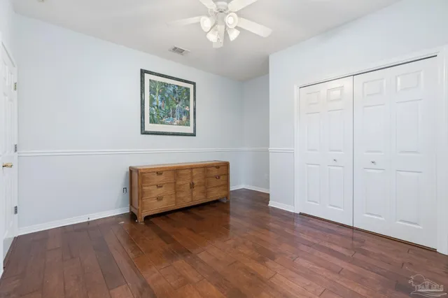 a view of a backyard house with swimming pool and sitting area