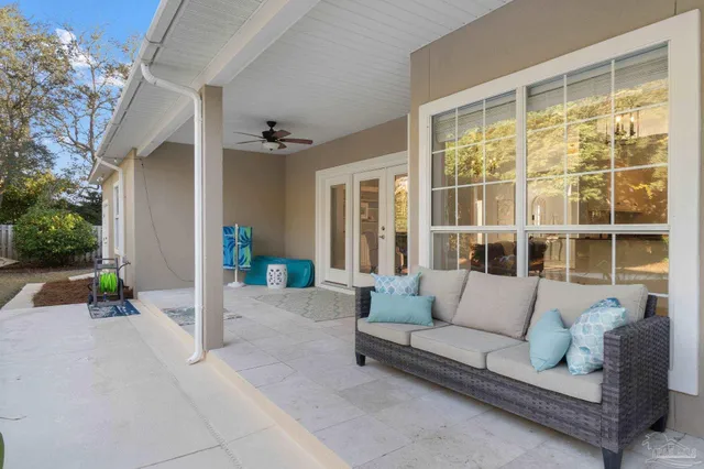 an aerial view of a house with a swimming pool yard and outdoor seating