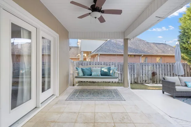 an aerial view of residential houses with outdoor space and swimming pool