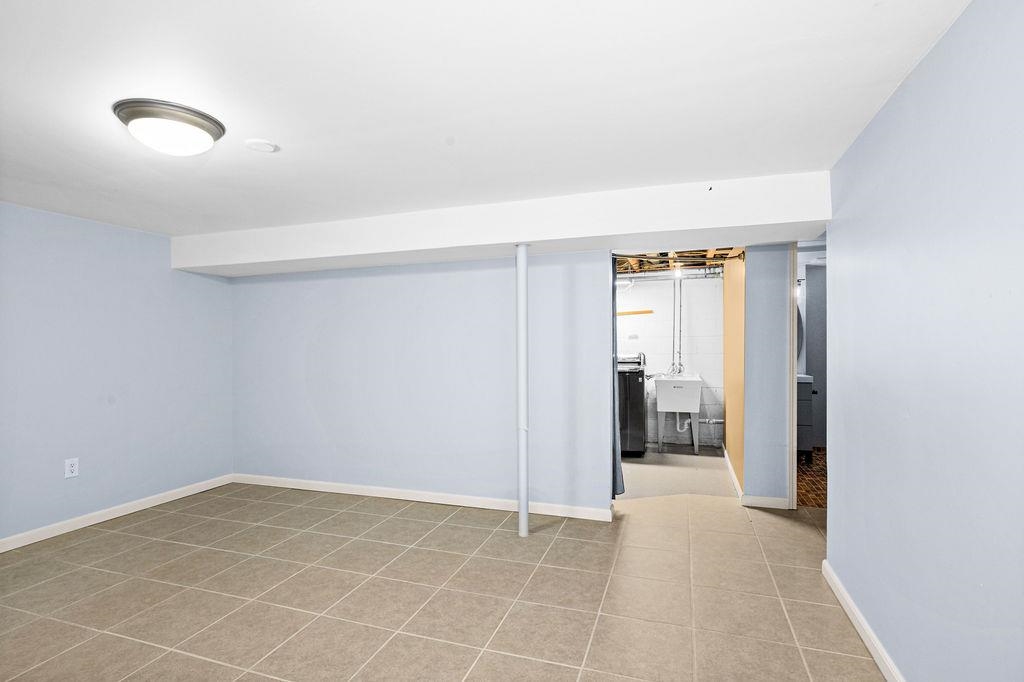 5007 Colorado Street Duluth, MN 55804 - Photo 15 of 31 Finished below grade area featuring light tile patterned floors and baseboards