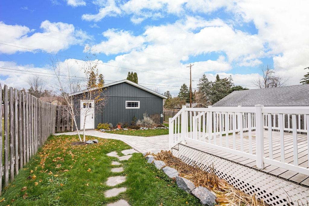 5007 Colorado Street Duluth, MN 55804 - Photo 24 of 31 Fenced backyard with an outdoor structure and a wooden deck