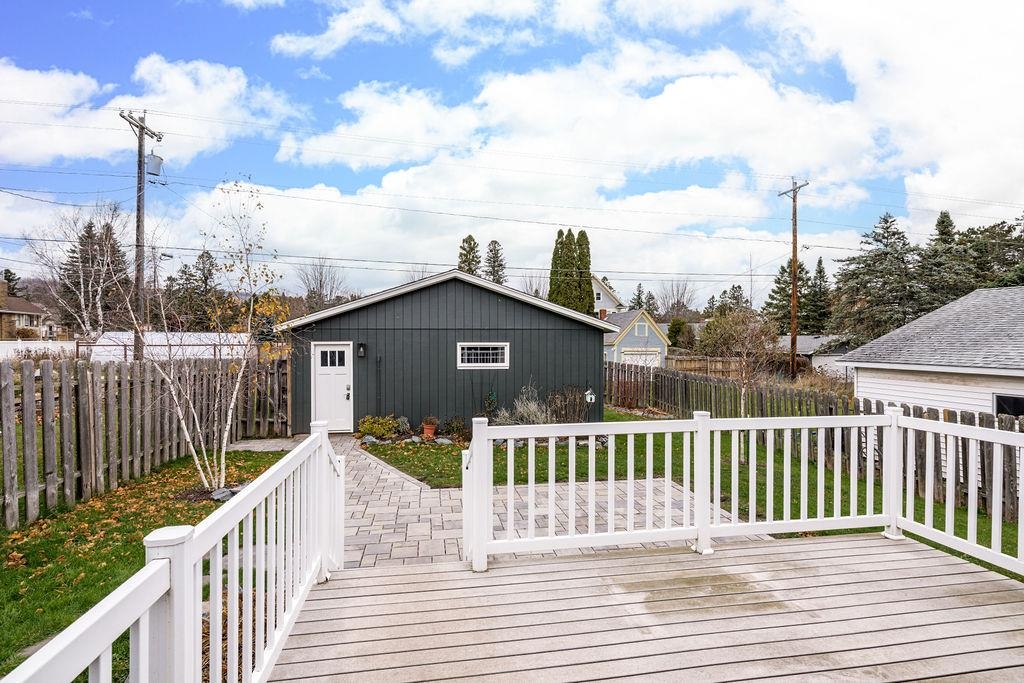 5007 Colorado Street Duluth, MN 55804 - Photo 26 of 31 Wooden deck with a fenced backyard and an outbuilding