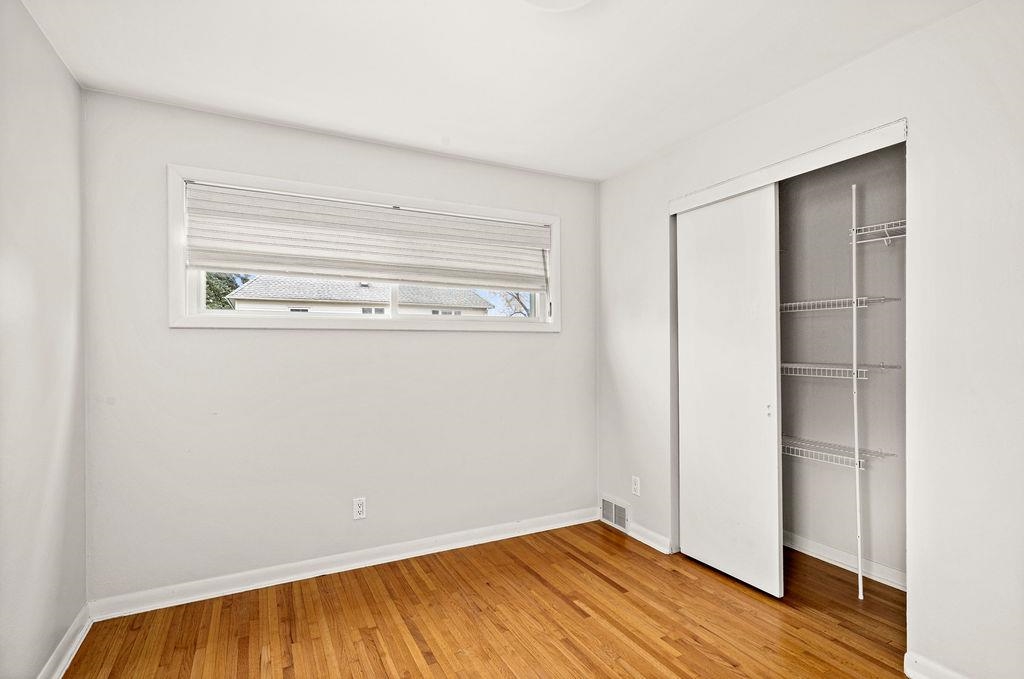 5007 Colorado Street Duluth, MN 55804 - Photo 10 of 31 Unfurnished bedroom featuring a closet and light wood-style flooring