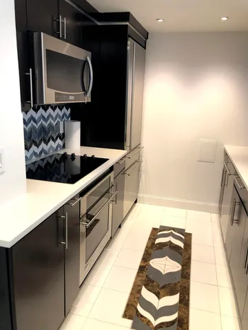 a bathroom with a bathtub and a sink