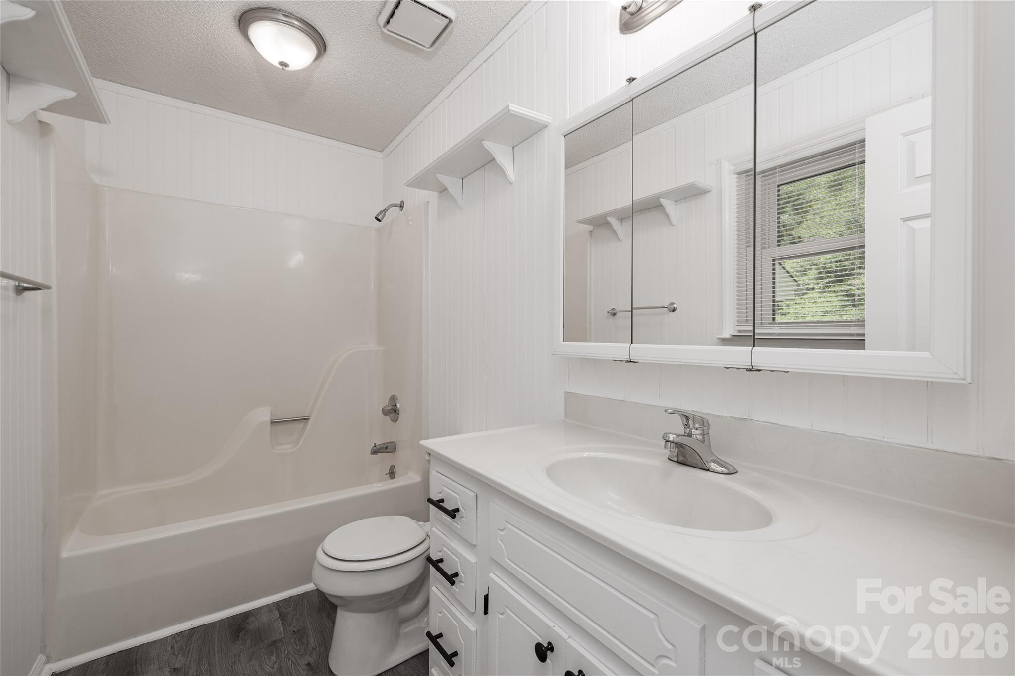 21014 Pine Ridge Drive Cornelius, NC 28031 - Photo 16 of 26 a bathroom with a sink toilet tub and shower
