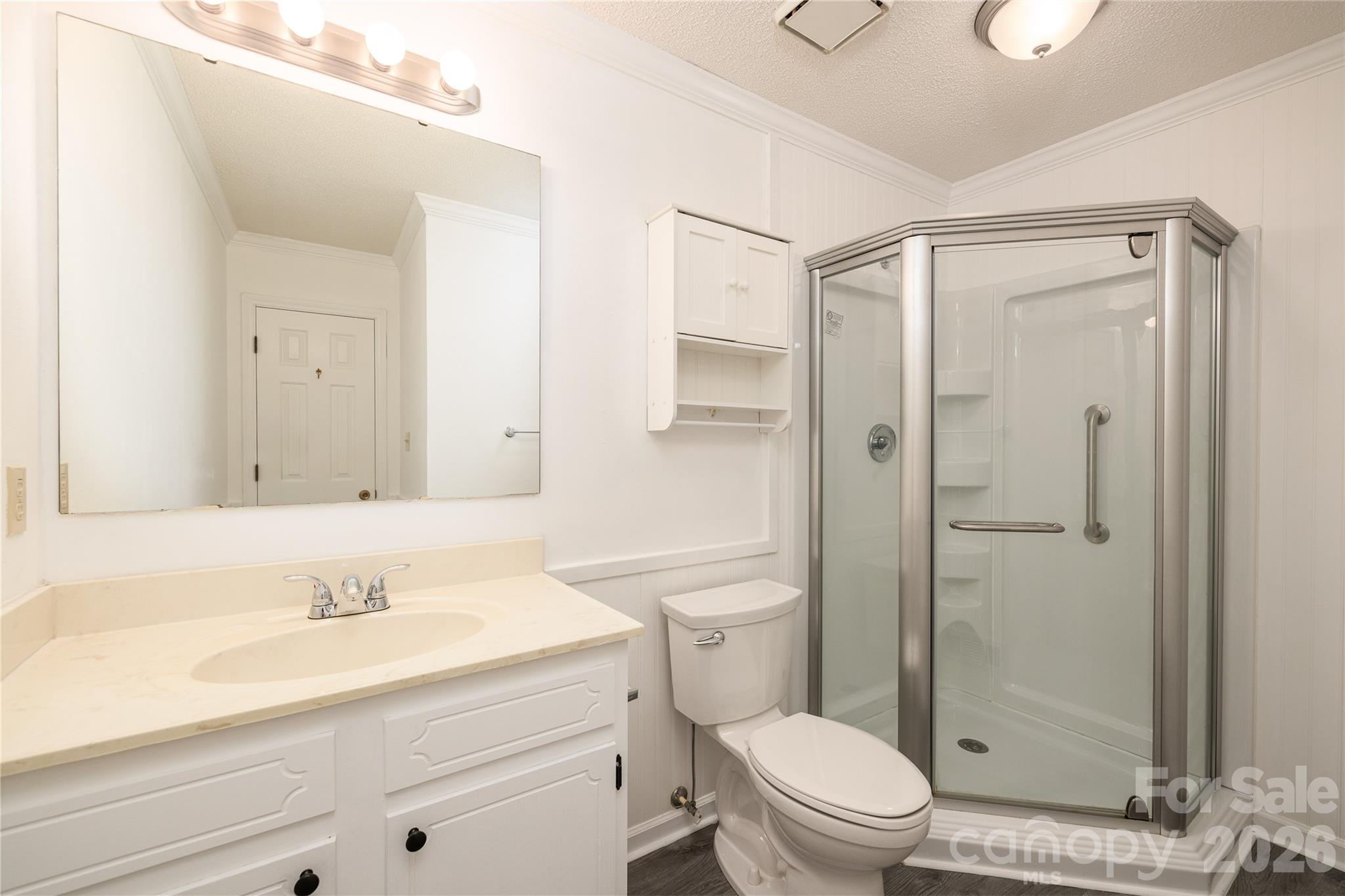 21014 Pine Ridge Drive Cornelius, NC 28031 - Photo 19 of 26 a bathroom with a sink a toilet and shower
