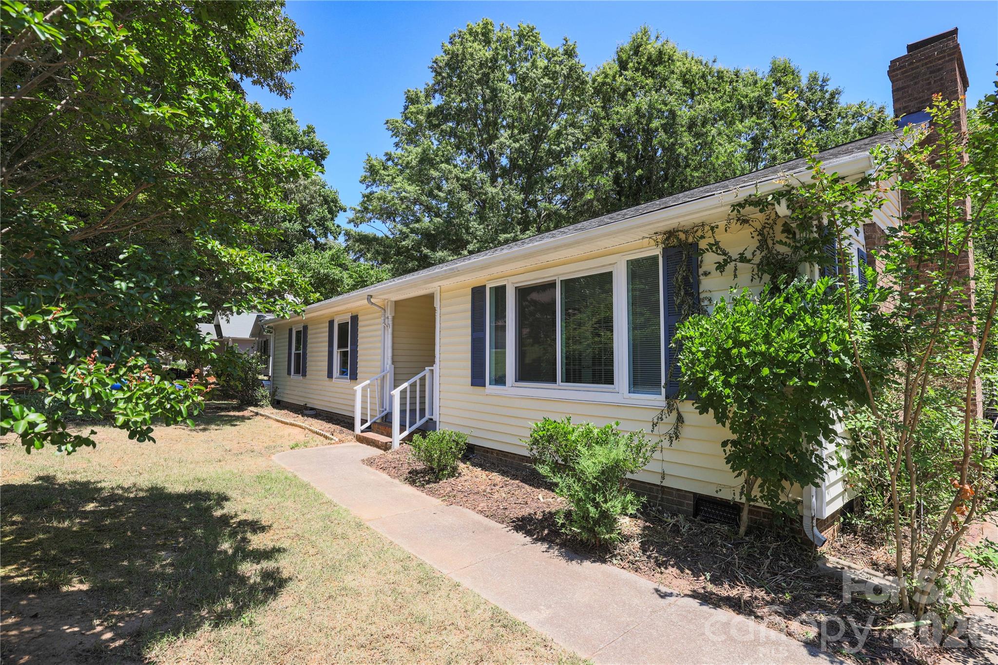 21014 Pine Ridge Drive Cornelius, NC 28031 - Photo 20 of 26 a front view of a house with garden