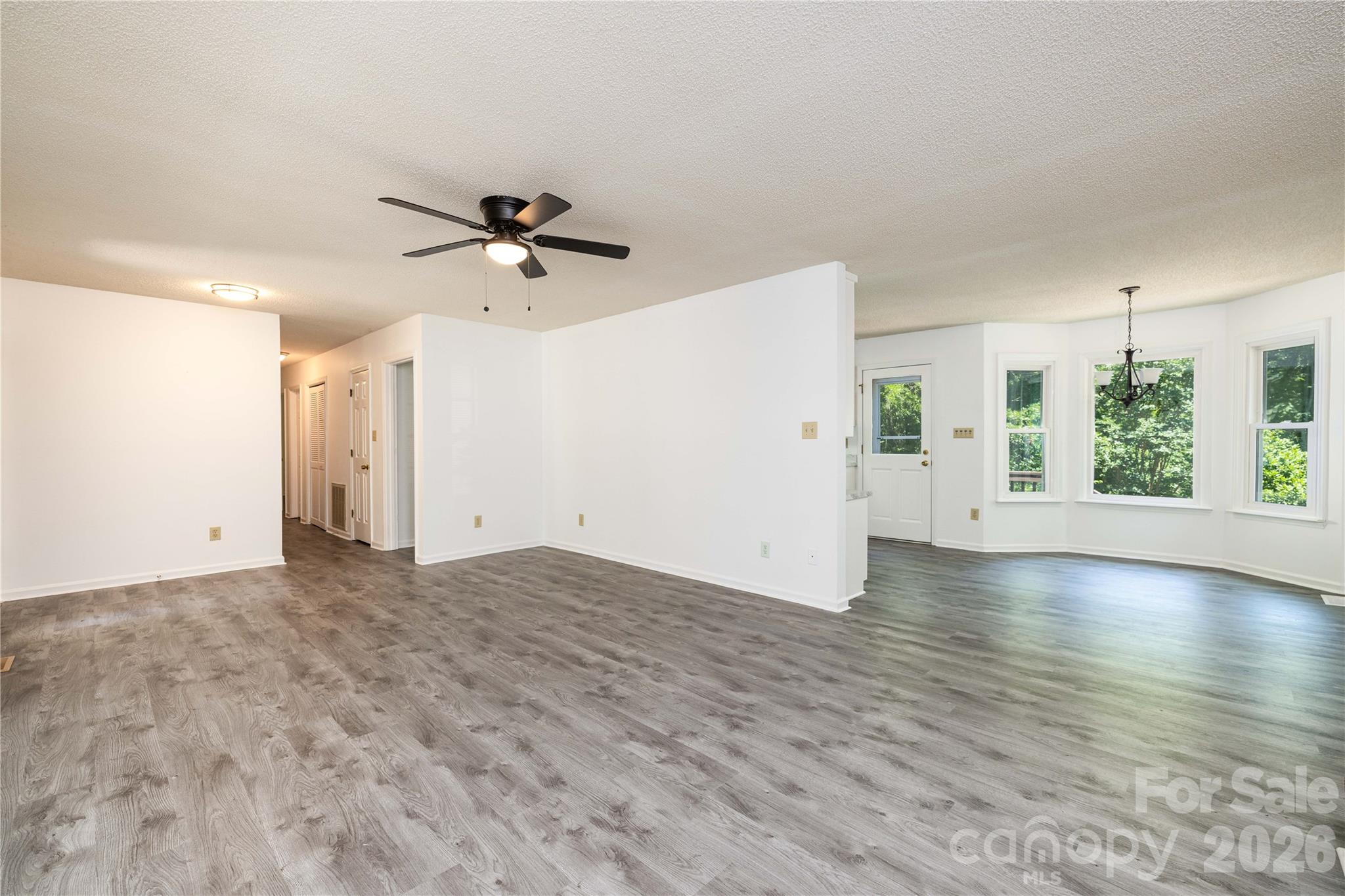 21014 Pine Ridge Drive Cornelius, NC 28031 - Photo 2 of 26 an empty room with fan and windows