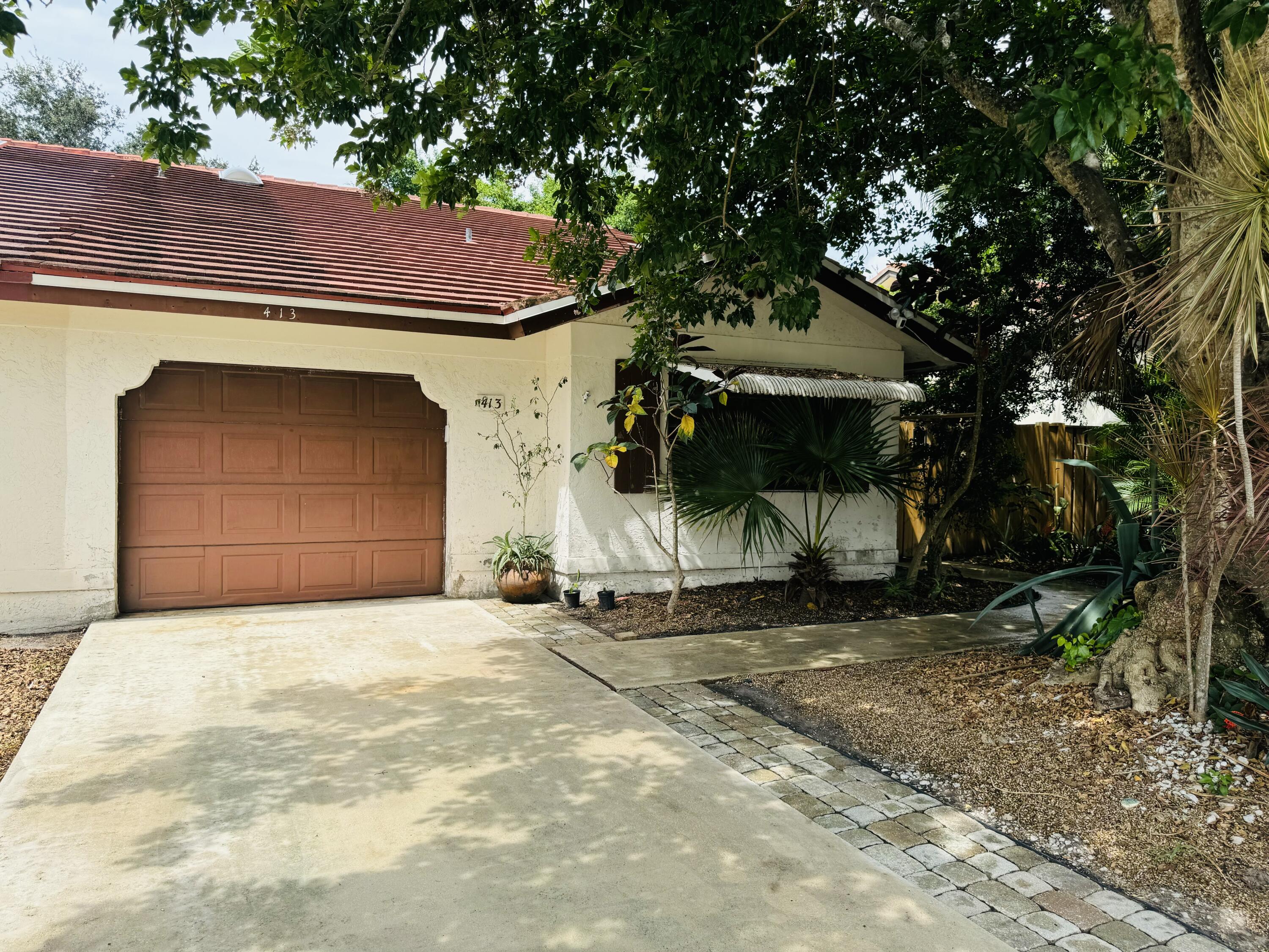 413 Northeast 38th Street Boca Raton, FL 33431 - Photo 1 of 11 Front of Home