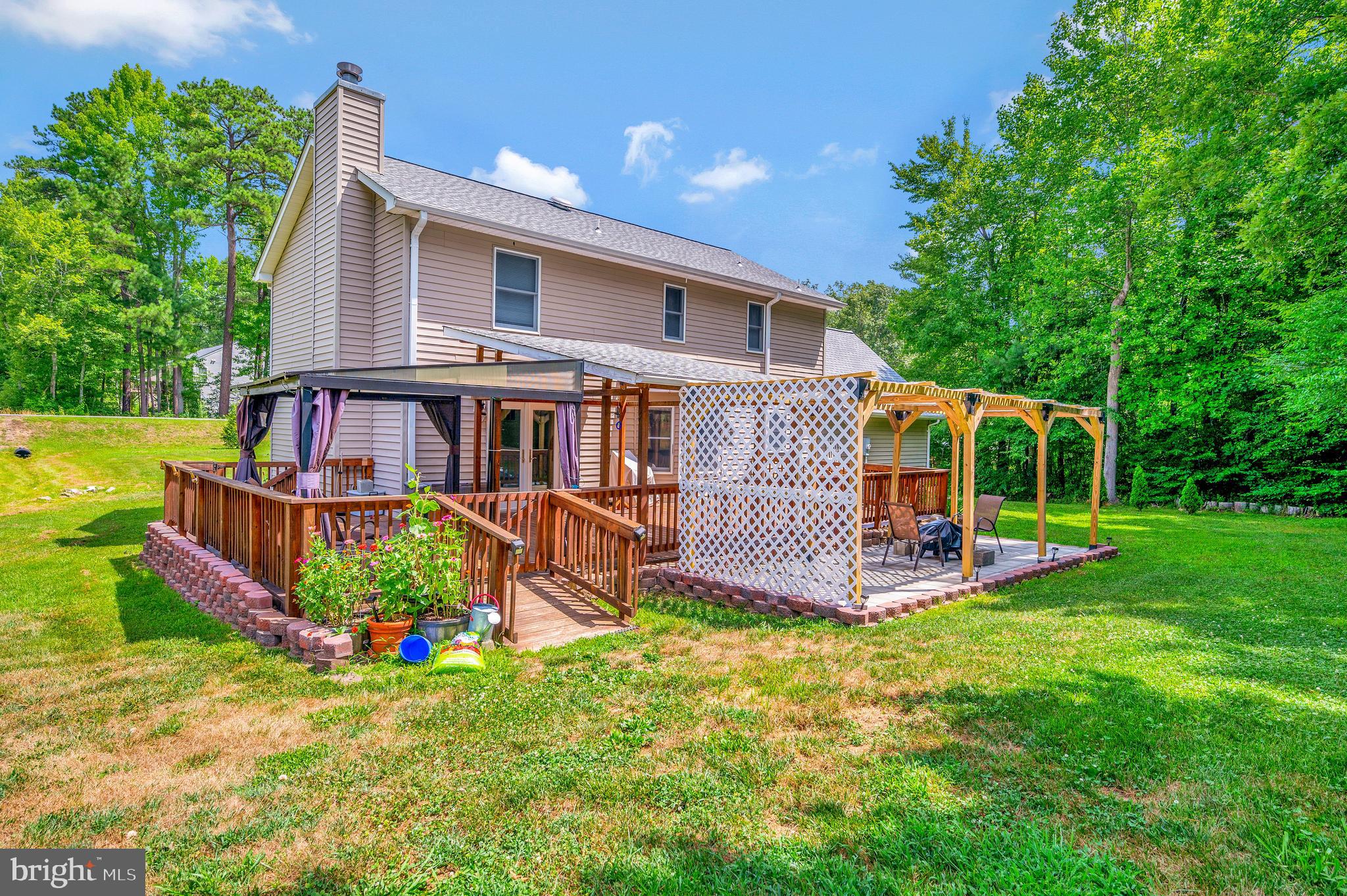633 Welsh Drive Ruther Glen, VA 22546 - Photo 37 of 71 Rear view with 16x40 covered patio