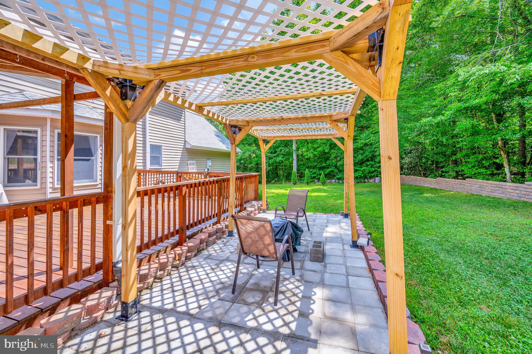 633 Welsh Drive Ruther Glen, VA 22546 - Photo 40 of 71 Covered area with fire pit