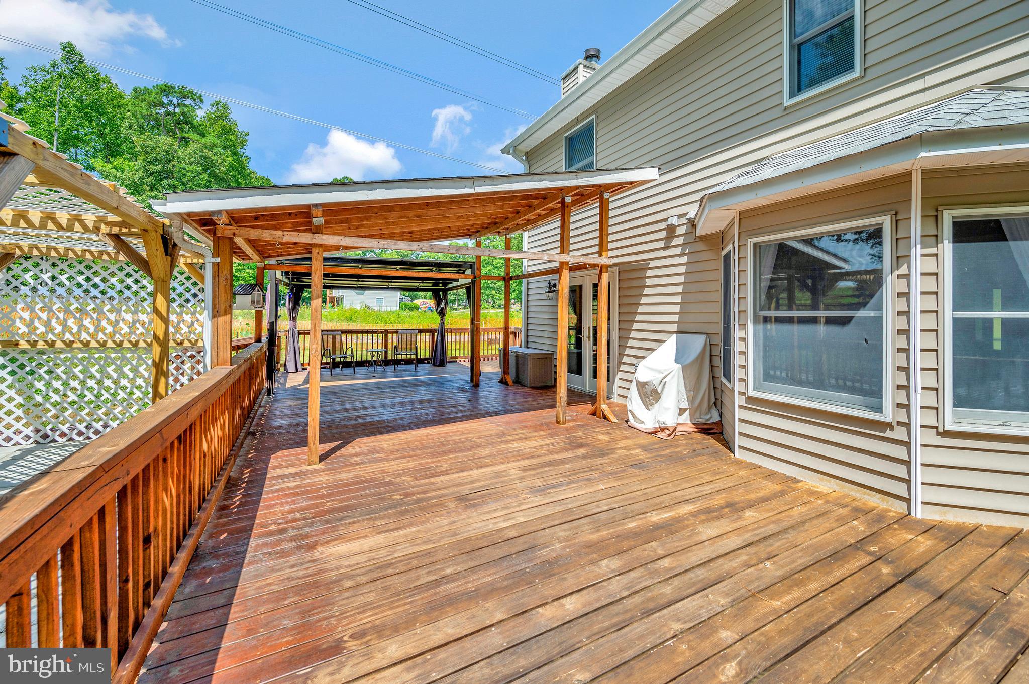 633 Welsh Drive Ruther Glen, VA 22546 - Photo 43 of 71 Wooden patio view off family room and kitchen