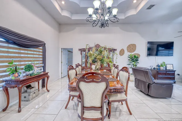 a view of a dining room with furniture window and outside view