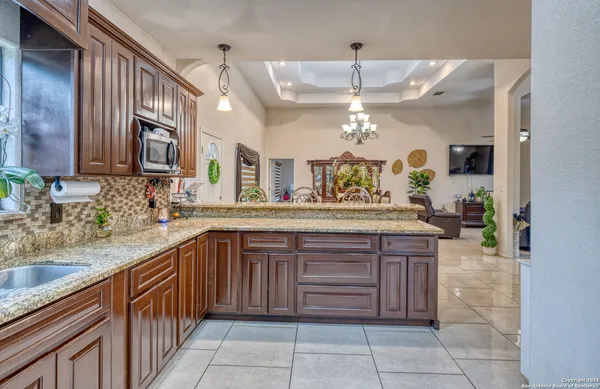 a kitchen with a sink and cabinets