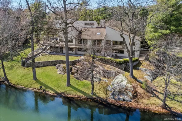 a swimming pool with trees in the background