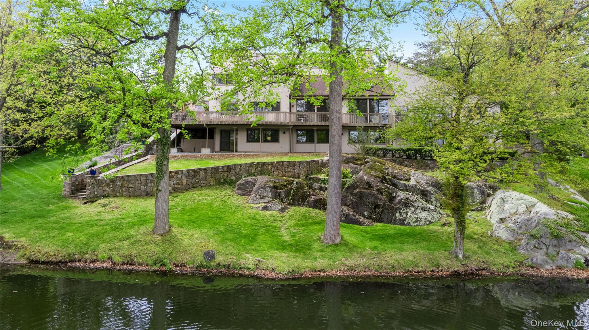 3 Lakeside Drive Rye, NY 10580 - Photo 22 of 31 a view of a house with a yard from a lake view