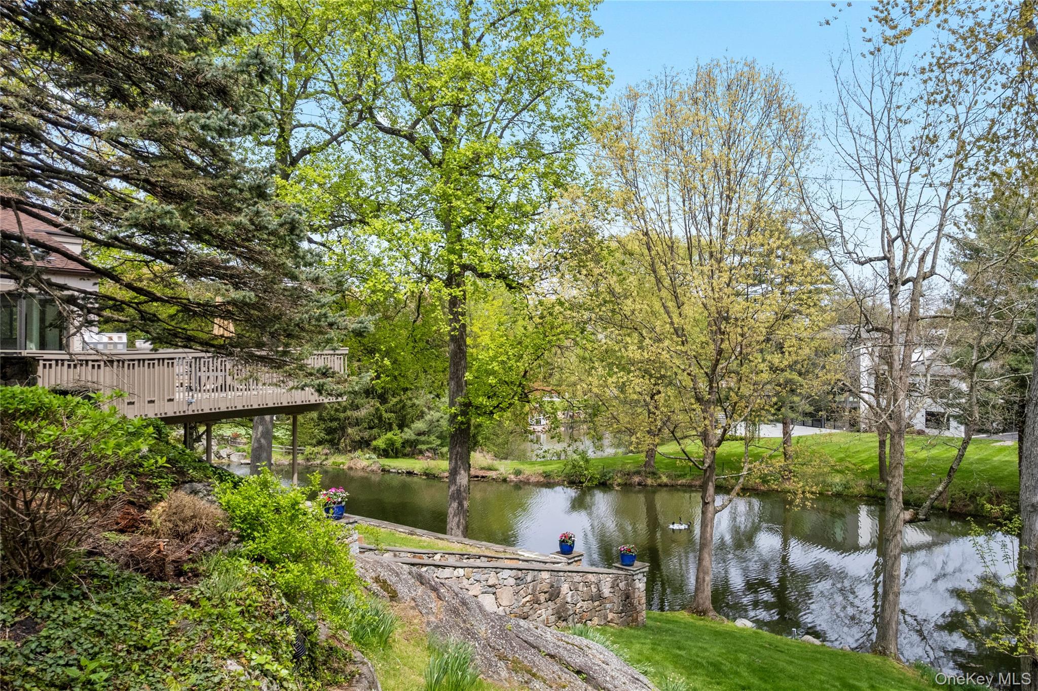 3 Lakeside Drive Rye, NY 10580 - Photo 23 of 31 a view of a lake with a house in background