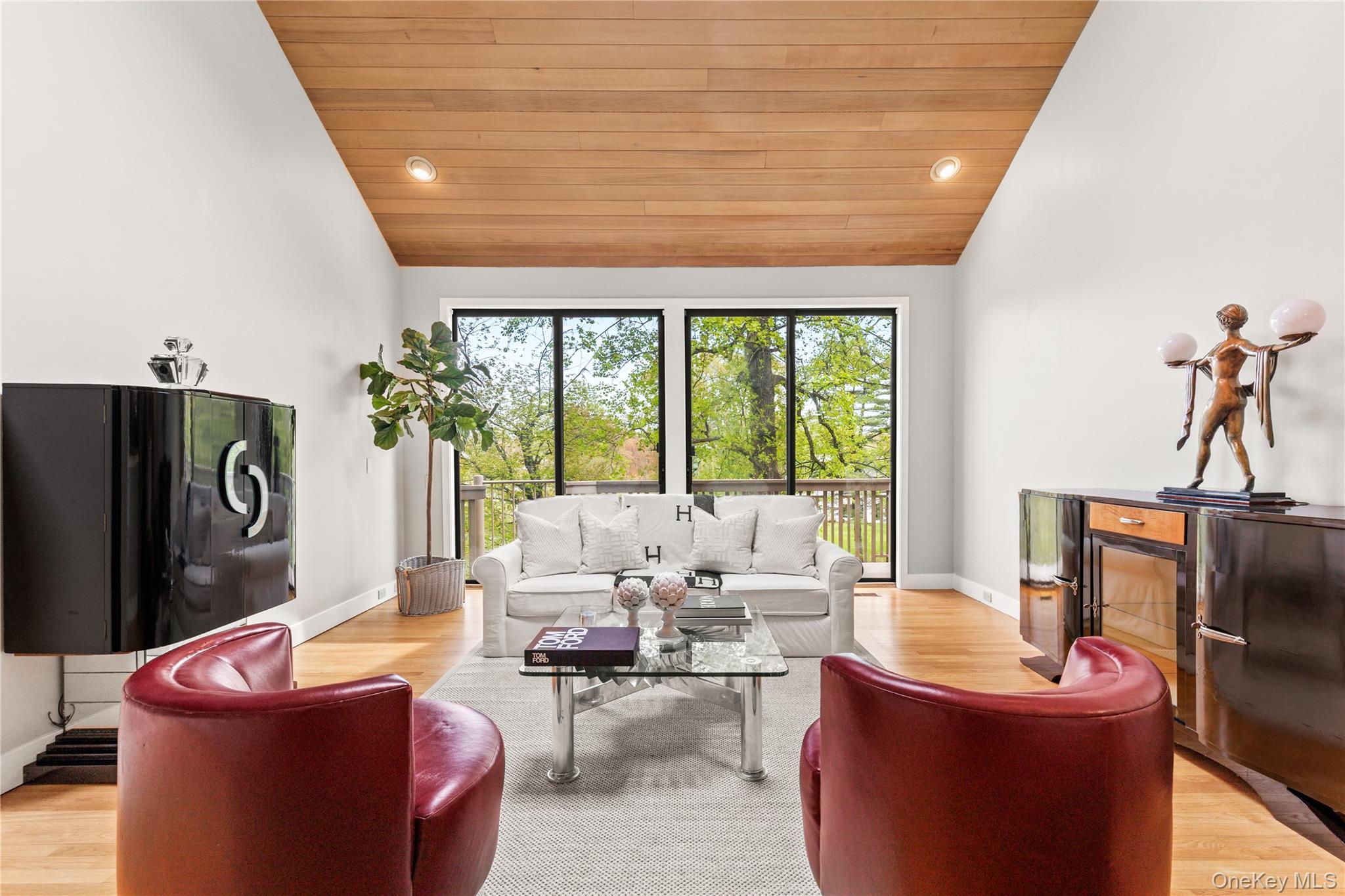 3 Lakeside Drive Rye, NY 10580 - Photo 6 of 31 a living room with furniture a flat screen tv and a large window
