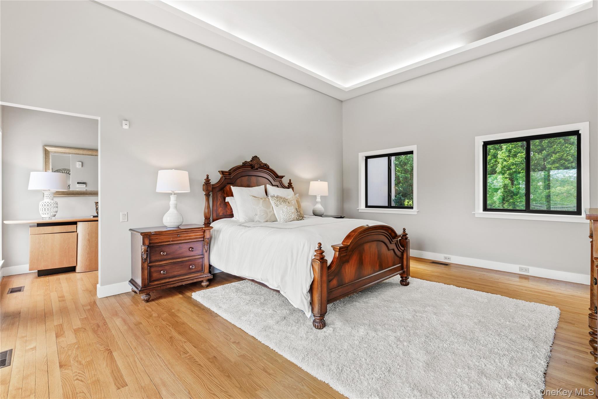 3 Lakeside Drive Rye, NY 10580 - Photo 9 of 31 a bedroom with a bed and wooden floor