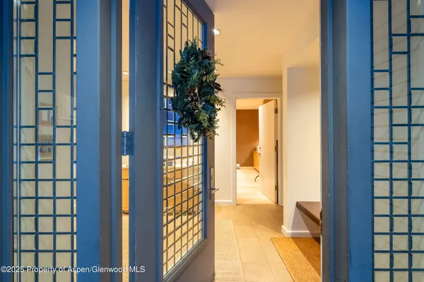 a view of a livingroom with furniture and a flat screen tv