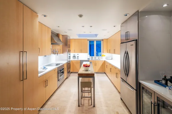 a bed room with a bed and a large window