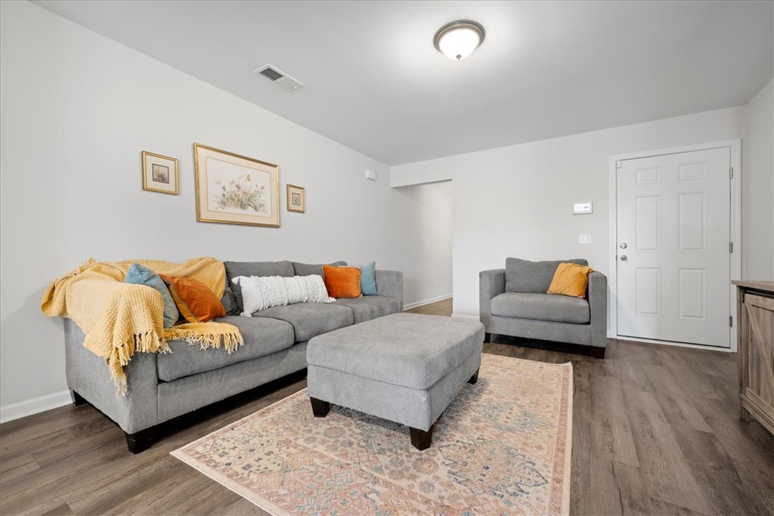 117 Adger Road Pendleton, SC 29670 - Photo 5 of 36 This inviting living area features warm flooring and a convenient entry point, perfect for daily living.