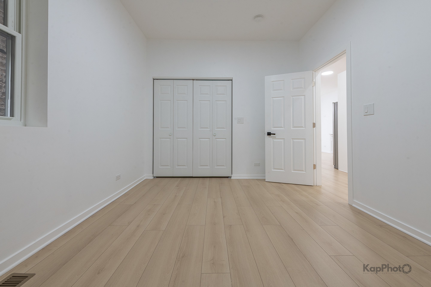 2139 West 24th Street Chicago, IL 60608 - Photo 16 of 29 a view of an empty room with wooden floor