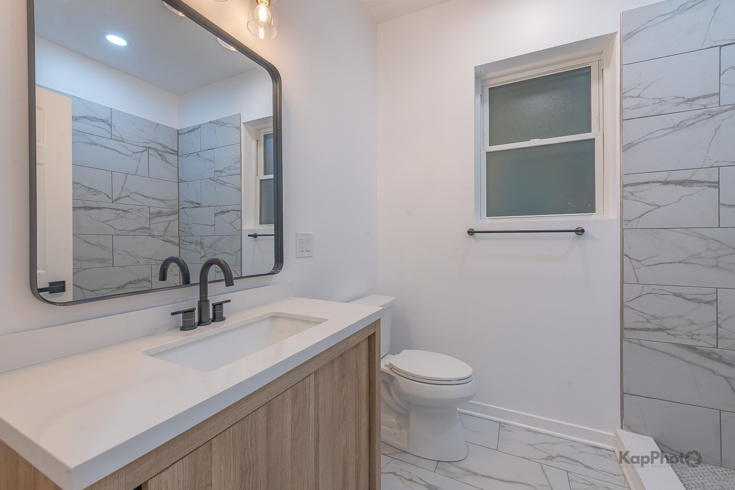2139 West 24th Street Chicago, IL 60608 - Photo 21 of 29 a bathroom with a sink a toilet and shower