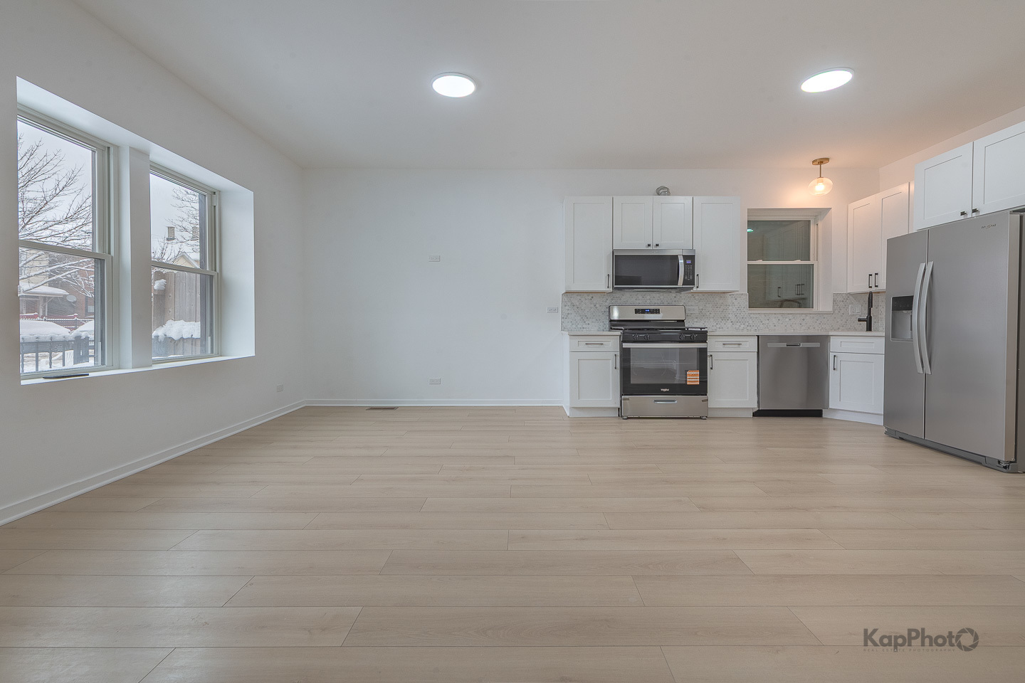 2139 West 24th Street Chicago, IL 60608 - Photo 6 of 29 a view of kitchen with stainless steel appliances wooden floor and window