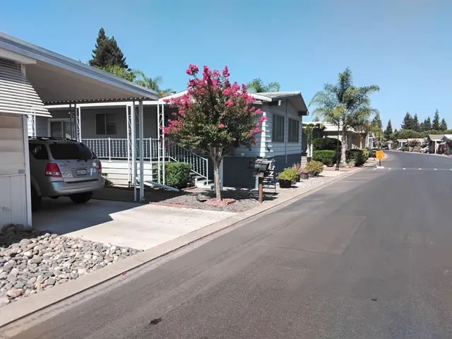 a view of a street with cars on the road