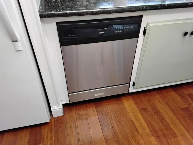 a view of water heater with wooden floor