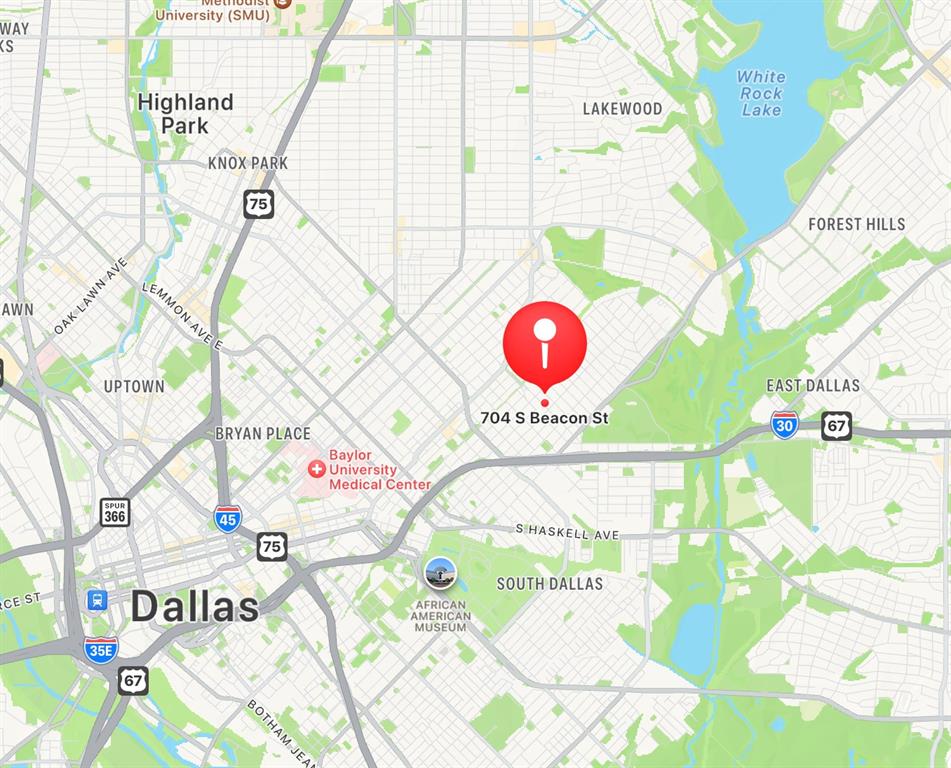 704 South Beacon Street Dallas, TX 75223 - Photo 6 of 6 a view of a table & chairs in a an umbrella