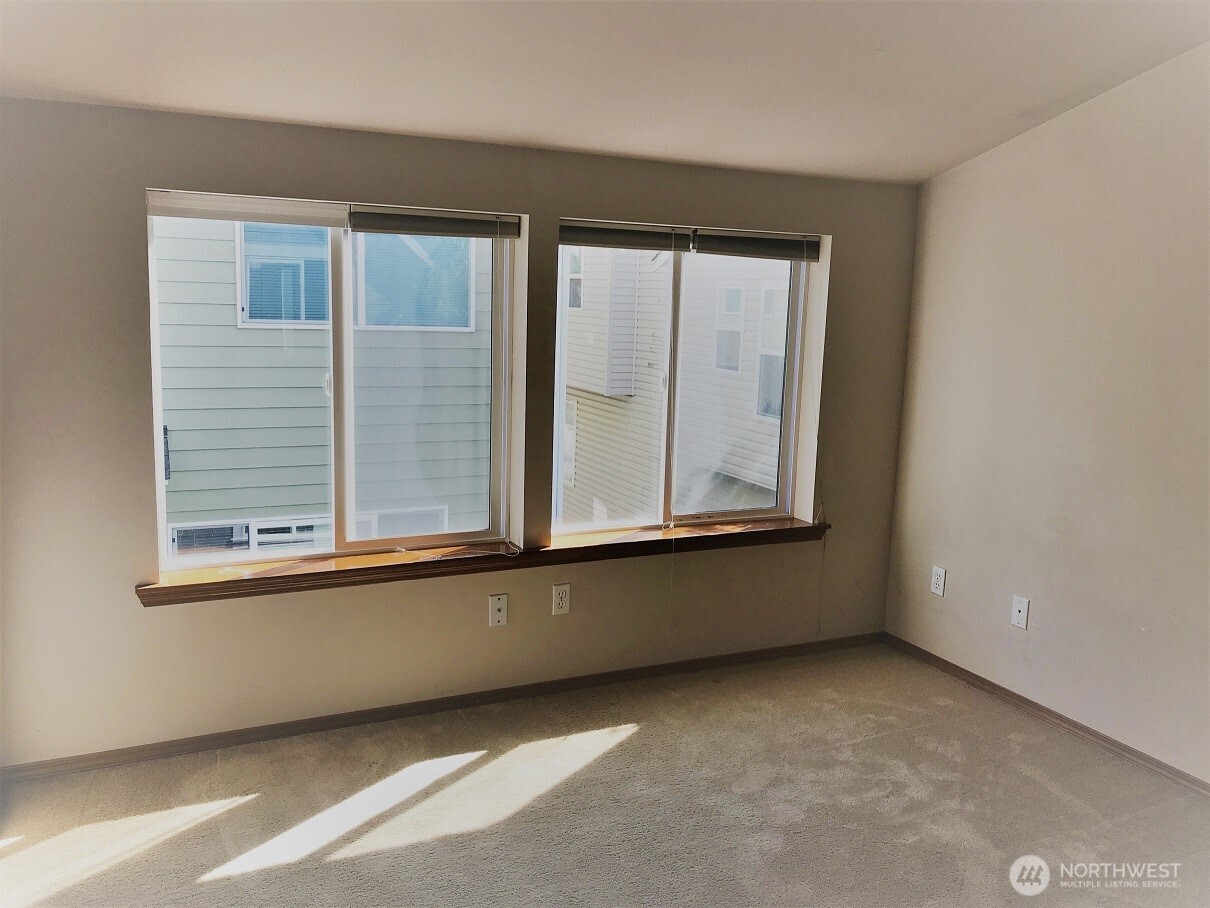 12723 35th Avenue Northeast, Unit A Seattle, WA 98125 - Photo 7 of 11 a view of an empty room with a window