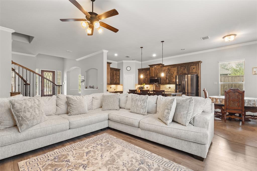 800 Goose Court Forney, TX 75126 - Photo 11 of 34 a living room with furniture and kitchen view