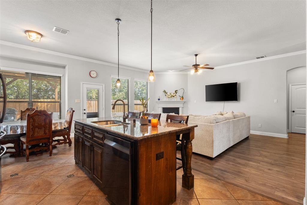 800 Goose Court Forney, TX 75126 - Photo 16 of 34 a living room with furniture and a flat screen tv