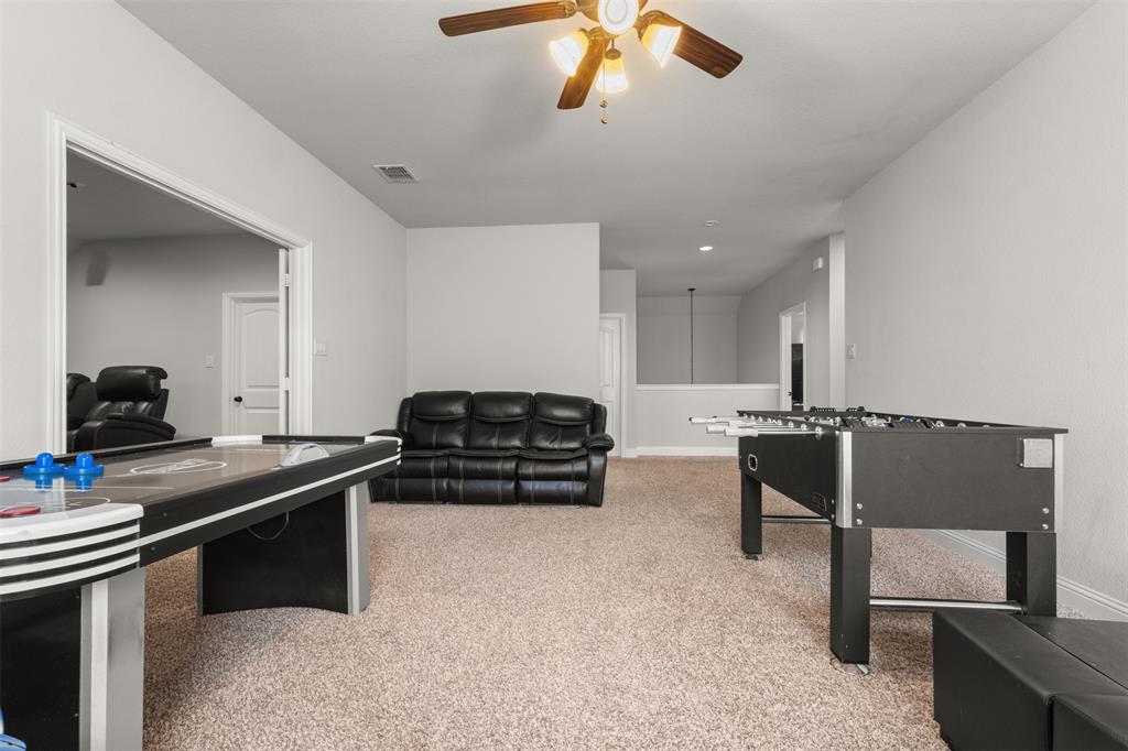 800 Goose Court Forney, TX 75126 - Photo 20 of 34 a kitchen with stainless steel appliances a sink a stove and a refrigerator