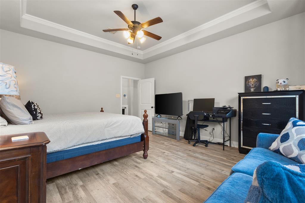 800 Goose Court Forney, TX 75126 - Photo 23 of 34 a bedroom with a bed and a television